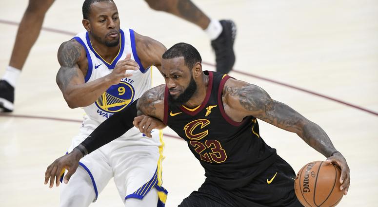 Cavaliers forward LeBron James (23) drives against Golden State Warriors forward Andre Iguodala (9) Cavaliers forward LeBron James (23) drives against Golden State Warriors forward Andre Iguodala (9)