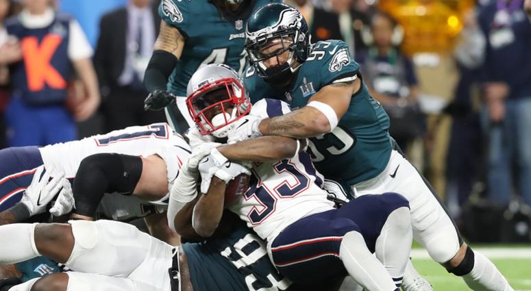 New England Patriots running back Dion Lewis (33) runs with the ball against Philadelphia Eagles linebacker Mychal Kendricks (95) and tackle Tim Jernigan (93) in Super Bowl LII New England Patriots running back Dion Lewis (33) runs with the ball against Philadelphia Eagles linebacker Mychal Kendricks (95) and tackle Tim Jernigan (93) in Super Bowl LII