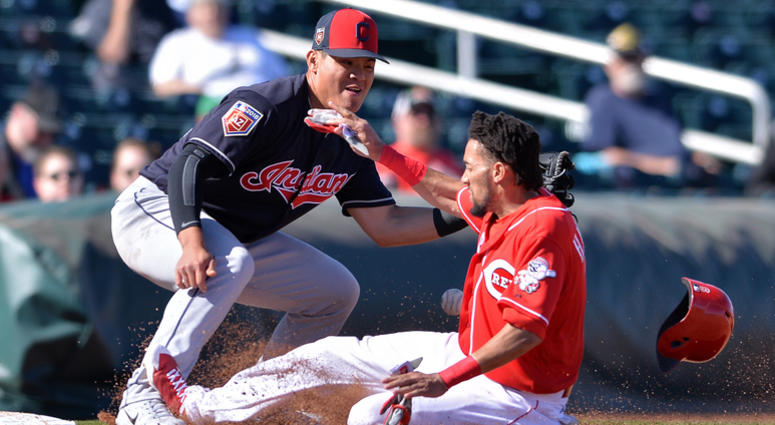 Feb 25, 2018; Goodyear, AZ, USA; Cincinnati Reds outfielder Billy Hamilton (right) advances to third on a single by third baseman Nick Senzel (not pictured) beating the tag by Cleveland Indians third baseman Yu Chang (left) during the sixth inning at Good Feb 25, 2018; Goodyear, AZ, USA; Cincinnati Reds outfielder Billy Hamilton (right) advances to third on a single by third baseman Nick Senzel (not pictured) beating the tag by Cleveland Indians third baseman Yu Chang (left) during the sixth inning at Good