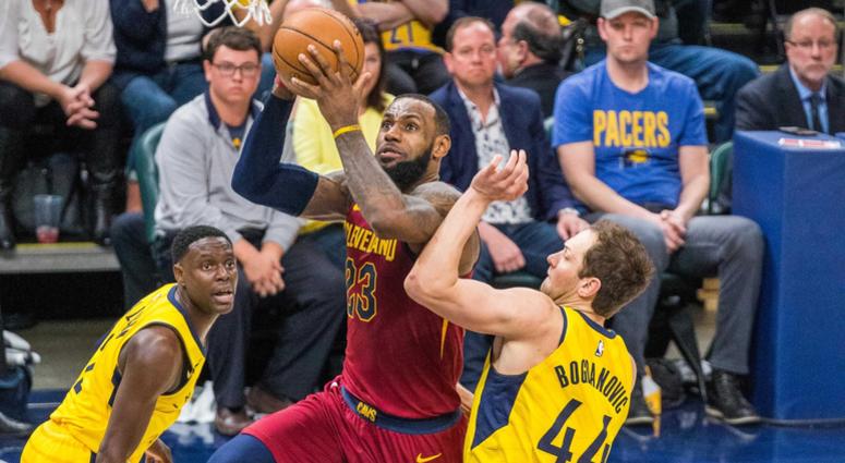 Cleveland Cavaliers forward LeBron James (23) shoots the ball while Indiana Pacers guard Darren Collison (2) and forward Bojan Bogdanovic (44) defend in the second half of game four. Cleveland Cavaliers forward LeBron James (23) shoots the ball while Indiana Pacers guard Darren Collison (2) and forward Bojan Bogdanovic (44) defend in the second half of game four.