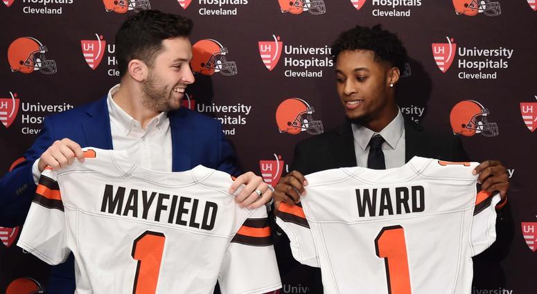 Cleveland Browns first round picks, Baker Mayfield , left, and Denzel Ward show off Browns jerseys during a press conference at the Cleveland Browns training facility. Cleveland Browns first round picks, Baker Mayfield , left, and Denzel Ward show off Browns jerseys during a press conference at the Cleveland Browns training facility.