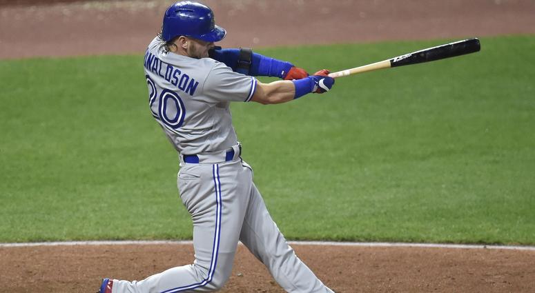Toronto Blue Jays third baseman Josh Donaldson (20) hits a solo home run in the fourth inning against the Cleveland Indians at Progressive Field. Toronto Blue Jays third baseman Josh Donaldson (20) hits a solo home run in the fourth inning against the Cleveland Indians at Progressive Field.