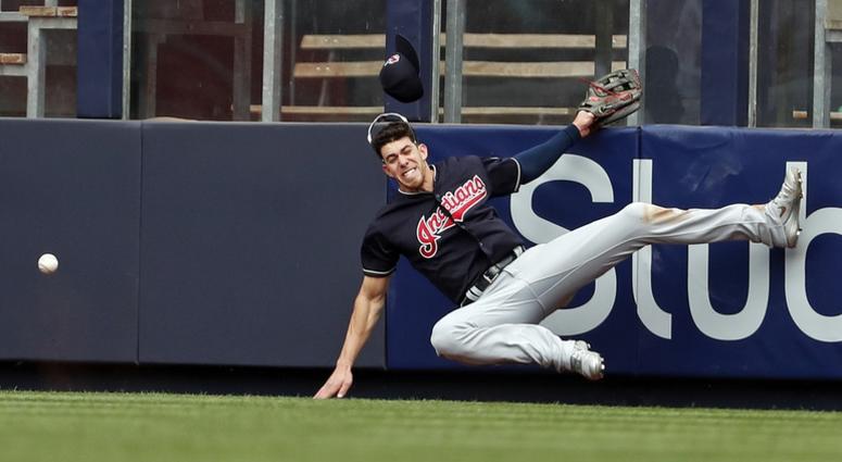 May 5, 2018; Bronx, NY, USA; Cleveland Indians center fielder Bradley Zimmer (4) collides with the wall attempting to catch a double by New York Yankees catcher Austin Romine (28) during the seventh inning at Yankee Stadium. Mandatory Credit: Adam Hunger- May 5, 2018; Bronx, NY, USA; Cleveland Indians center fielder Bradley Zimmer (4) collides with the wall attempting to catch a double by New York Yankees catcher Austin Romine (28) during the seventh inning at Yankee Stadium. Mandatory Credit: Adam Hunger-