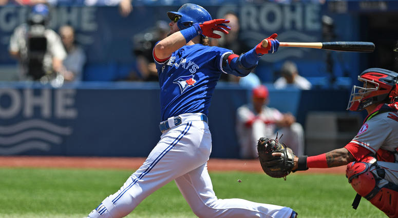 May 24, 2018; Toronto, Ontario, CAN; Toronto Blue Jays third base Josh Donaldson (20) hits a single during the regular season MLB game between the Los Angeles Angels and Toronto Blue Jays at Rogers Centre. May 24, 2018; Toronto, Ontario, CAN; Toronto Blue Jays third base Josh Donaldson (20) hits a single during the regular season MLB game between the Los Angeles Angels and Toronto Blue Jays at Rogers Centre.
