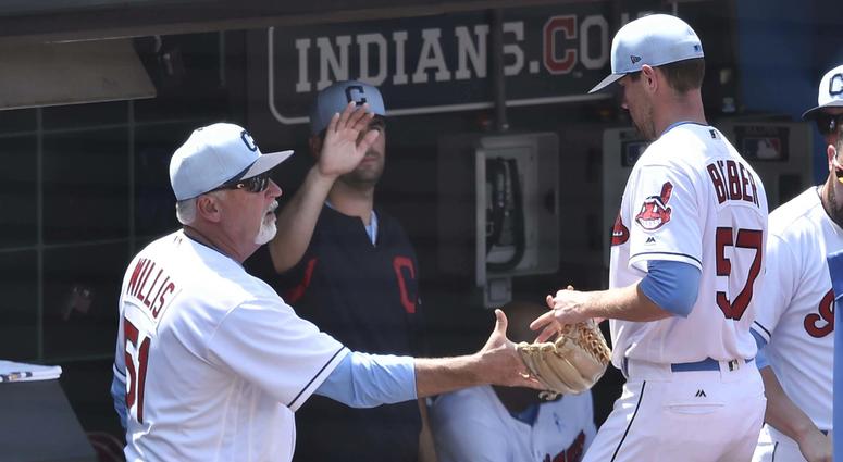 Jun 17, 2018; Cleveland, OH, USA; Cleveland Indians pitching coach Carl Willis (51) congratulates starting pitcher Shane Bieber (57) in the sixth inning against the Minnesota Twins at Progressive Field. Jun 17, 2018; Cleveland, OH, USA; Cleveland Indians pitching coach Carl Willis (51) congratulates starting pitcher Shane Bieber (57) in the sixth inning against the Minnesota Twins at Progressive Field.