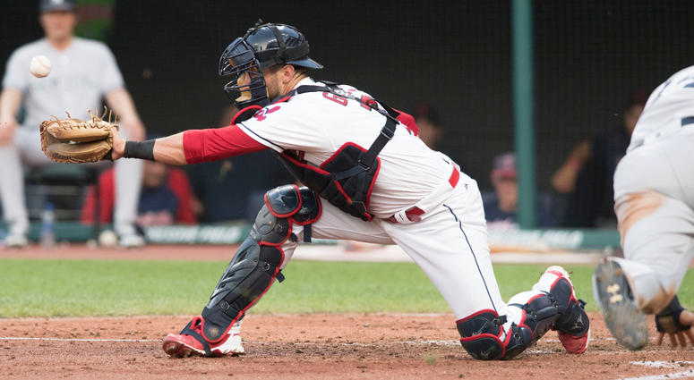 Jul 13, 2018; Cleveland, OH, USA; Cleveland Indians catcher Yan Gomes (7) misplays the ball on a sacrifice hit by New York Yankees left fielder Brett Gardner as New York Yankees second baseman Neil Walker (14) sores during the fifth inning at Progressive Jul 13, 2018; Cleveland, OH, USA; Cleveland Indians catcher Yan Gomes (7) misplays the ball on a sacrifice hit by New York Yankees left fielder Brett Gardner as New York Yankees second baseman Neil Walker (14) sores during the fifth inning at Progressive