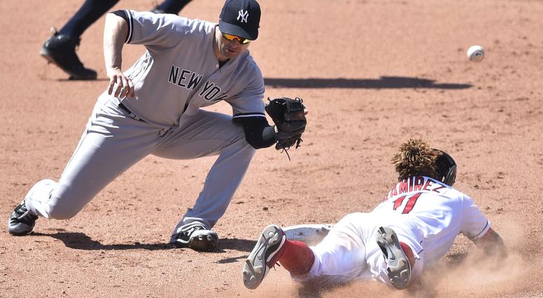 Jul 15, 2018; Cleveland, OH, USA; Cleveland Indians third baseman Jose Ramirez (11) steals second base beside New York Yankees second baseman Neil Walker (14) in the eighth inning at Progressive Field. Jul 15, 2018; Cleveland, OH, USA; Cleveland Indians third baseman Jose Ramirez (11) steals second base beside New York Yankees second baseman Neil Walker (14) in the eighth inning at Progressive Field.