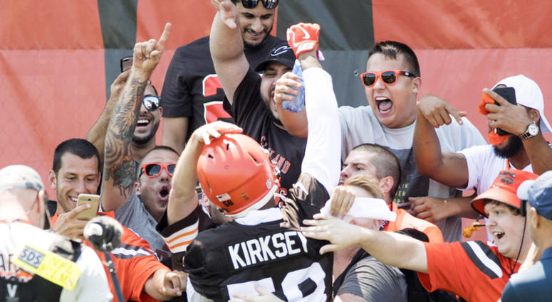 Fans greet Cleveland Browns linebacker Christian Kirksey (58) during training camp at the Cleveland Browns Training Complex.