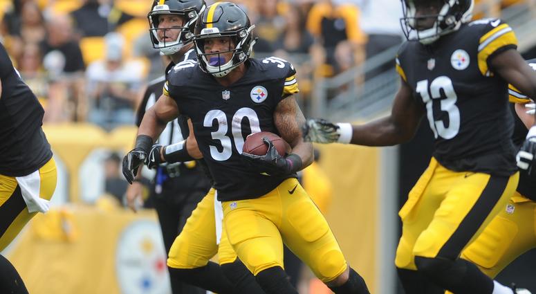 Pittsburgh Steelers running back James Conner (30) picks up short yards in the first quarter against the Tennessee Titans at Heinz Field Pittsburgh Steelers running back James Conner (30) picks up short yards in the first quarter against the Tennessee Titans at Heinz Field