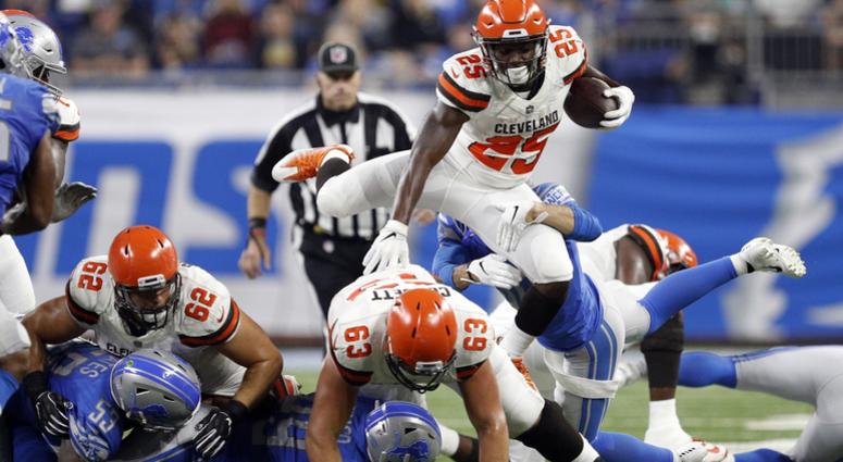 Cleveland Browns running back Dontrell Hilliard (25) hurdles players during the second quarter against the Detroit Lions at Ford Field. Dontrell Hilliard Cleveland Browns