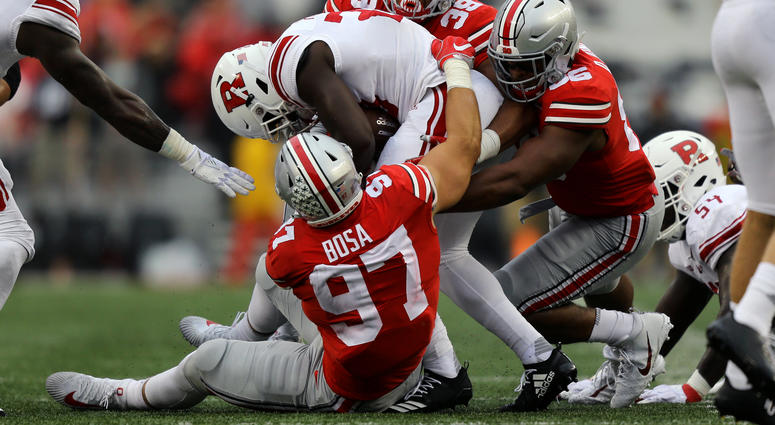 Sep 8, 2018; Columbus, OH, USA; Rutgers Scarlet Knights running back Jonathan Hilliman (23) is tackled by Ohio State Buckeyes defensive end Nick Bosa (97), defensive end Javontae Jean-Baptiste (38), and defensive tackle Dre'Mont Jones (86) in the first ha Sep 8, 2018; Columbus, OH, USA; Rutgers Scarlet Knights running back Jonathan Hilliman (23) is tackled by Ohio State Buckeyes defensive end Nick Bosa (97), defensive end Javontae Jean-Baptiste (38), and defensive tackle Dre'Mont Jones (86) in the first ha