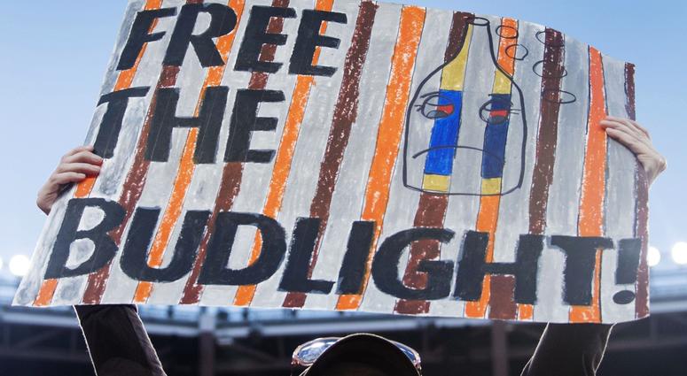 Janelle Clemons holds a sign referencing the free beer that will be given away by Budweiser if the Cleveland Browns win a game at FirstEnergy Stadium. Janelle Clemons holds a sign referencing the free beer that will be given away by Budweiser if the Cleveland Browns win a game at FirstEnergy Stadium.
