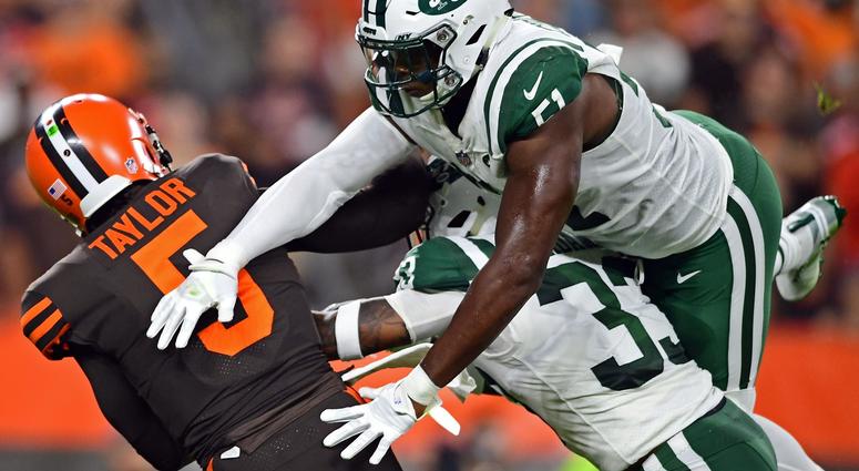New York Jets linebacker Brandon Copeland (51) andNew York Jets defensive back Jamal Adams (33) hits Cleveland Browns quarterback Tyrod Taylor (5) during the first half of a game at FirstEnergy Stadium. Cleveland Browns Tyrod Taylor New York Jets