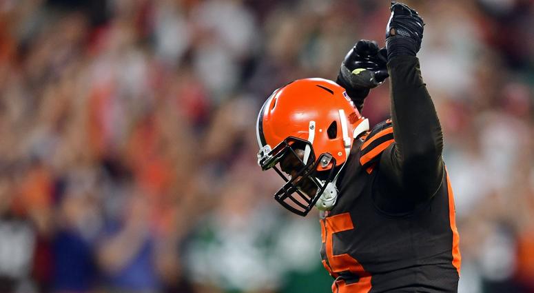 Cleveland Browns defensive tackle Larry Ogunjobi (65) celebrates after a Cleveland Browns linebacker Joe Schobert (53) interception during the second half of a game against the New York Jets at FirstEnergy Stadium. Cleveland Browns defensive tackle Larry Ogunjobi (65) celebrates after a Cleveland Browns linebacker Joe Schobert (53) interception during the second half of a game against the New York Jets at FirstEnergy Stadium.
