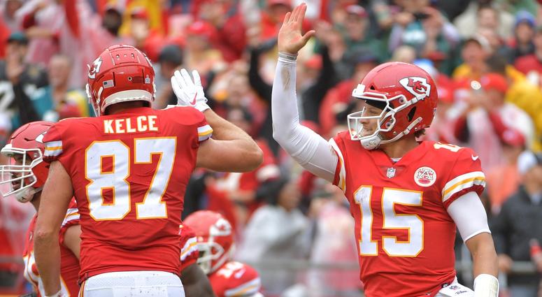 Kansas City Chiefs quarterback Patrick Mahomes (15) celebrates with tight end Travis Kelce (87) after scoring a touchdown during the first half against the Jacksonville Jaguars at Arrowhead Stadium. Pat Mahomes, Travis Kelce Kansas City Chiefs touchdown