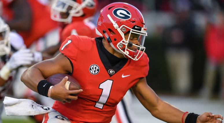 Georgia Bulldogs quarterback Justin Fields (1) runs for a touchdown against the Massachusetts Minutemen during the first half at Sanford Stadium. Georgia Bulldogs quarterback Justin Fields (1) runs for a touchdown against the Massachusetts Minutemen during the first half at Sanford Stadium.