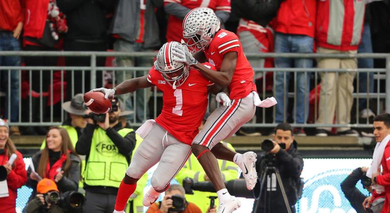 Ohio State Buckeyes wide receiver Johnnie Dixon (1) is congratulated by receiver Binjimen Victor (9) after scoring a second quarter touchdown against the Michigan Wolverines at Ohio Stadium. Johnnie Dixon Binjimen Victor Ohio State