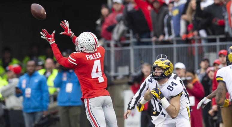 Michigan Wolverines tight end Sean McKeon (84) looks on as Ohio State Buckeyes safety Jordan Fuller (4) intercepts a pass at Ohio Stadium. Jordan Fuller Ohio State