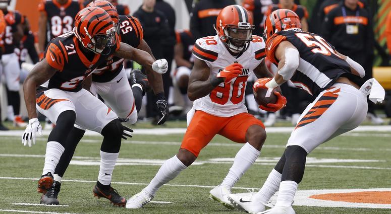 Cleveland Browns wide receiver Jarvis Landry (80) runs against Cincinnati Bengals defensive back Darqueze Dennard (21) and outside linebacker Jordan Evans (50) during the first half at Paul Brown Stadium