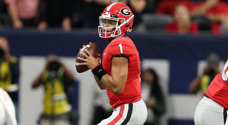 Georgia Bulldogs quarterback Justin Fields (1) looks to throw against the Alabama Crimson Tide during the second quarter in the SEC championship game at Mercedes-Benz Stadium. Georgia Bulldogs quarterback Justin Fields (1) looks to throw against the Alabama Crimson Tide during the second quarter in the SEC championship game at Mercedes-Benz Stadium.