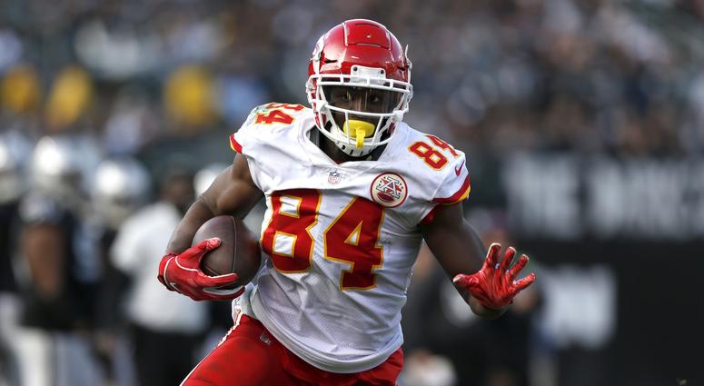 Dec 2, 2018; Oakland, CA, USA; Kansas City Chiefs tight end Demetrius Harris (84) runs with the ball after making a catch against the Oakland Raiders in the third quarter at Oakland Coliseum