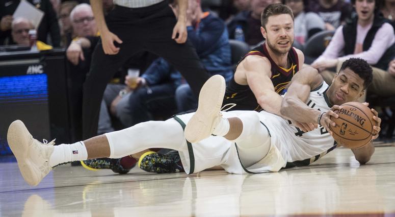 Cleveland Cavaliers guard Matthew Dellavedova (18) and Milwaukee Bucks forward Giannis Antetokounmpo (34) battle for a loose ball during the second half at Quicken Loans Arena. Cleveland Cavaliers guard Matthew Dellavedova (18) and Milwaukee Bucks forward Giannis Antetokounmpo (34) battle for a loose ball during the second half at Quicken Loans Arena.