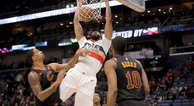 New Orleans Pelicans forward Anthony Davis (23) dunks over Cleveland Cavaliers guard Jordan Clarkson (8) and guard Alec Burks (10) during the first quarter at the Smoothie King Center. New Orleans Pelicans forward Anthony Davis (23) dunks over Cleveland Cavaliers guard Jordan Clarkson (8) and guard Alec Burks (10) during the first quarter at the Smoothie King Center.