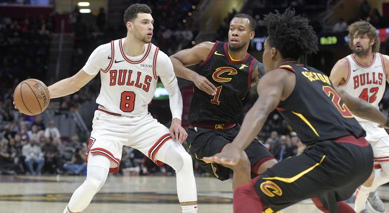 Jan 21, 2019; Cleveland, OH, USA; Chicago Bulls guard Zach LaVine (8) dribbles against Cleveland Cavaliers guard Rodney Hood (1) and guard Collin Sexton (2) in the third quarter at Quicken Loans Arena. Mandatory Credit: David Richard-USA TODAY Sports Jan 21, 2019; Cleveland, OH, USA; Chicago Bulls guard Zach LaVine (8) dribbles against Cleveland Cavaliers guard Rodney Hood (1) and guard Collin Sexton (2) in the third quarter at Quicken Loans Arena. Mandatory Credit: David Richard-USA TODAY Sports