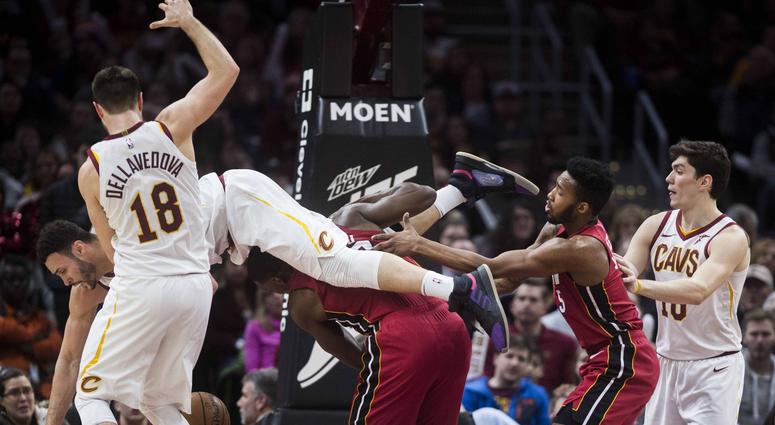 Cleveland Cavaliers forward Larry Nance Jr. (22) comes down on top of Miami Heat center Bam Adebayo (13) during the second half at Quicken Loans Arena. Cleveland Cavaliers forward Larry Nance Jr. (22) comes down on top of Miami Heat center Bam Adebayo (13) during the second half at Quicken Loans Arena.