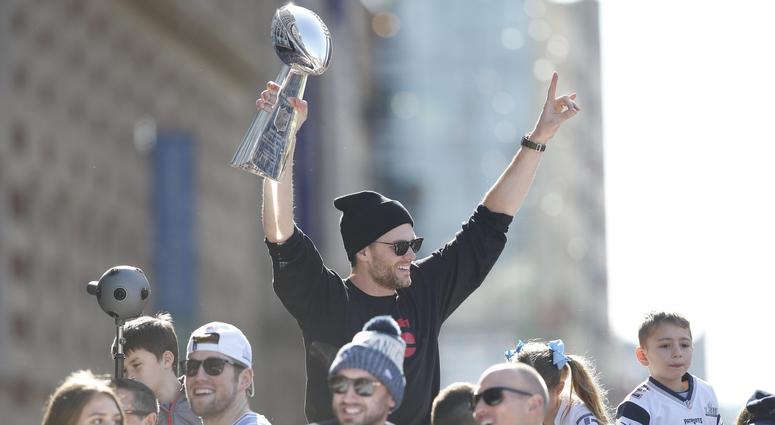 Feb 5, 2019; Boston, MA, USA; New England Patriots quarterback Tom Brady (12) holds up the Vince Lombardi Trophy during the Super Bowl LIII championship parade through downtown Boston. Mandatory Credit: Greg M. Cooper-USA TODAY Sports Feb 5, 2019; Boston, MA, USA; New England Patriots quarterback Tom Brady (12) holds up the Vince Lombardi Trophy during the Super Bowl LIII championship parade through downtown Boston. Mandatory Credit: Greg M. Cooper-USA TODAY Sports
