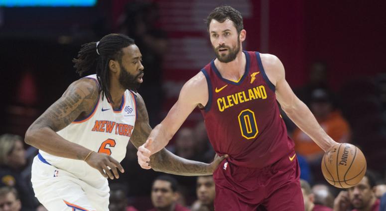 New York Knicks center DeAndre Jordan (6) guards Cleveland Cavaliers forward Kevin Love (0) during the first half at Quicken Loans Arena.