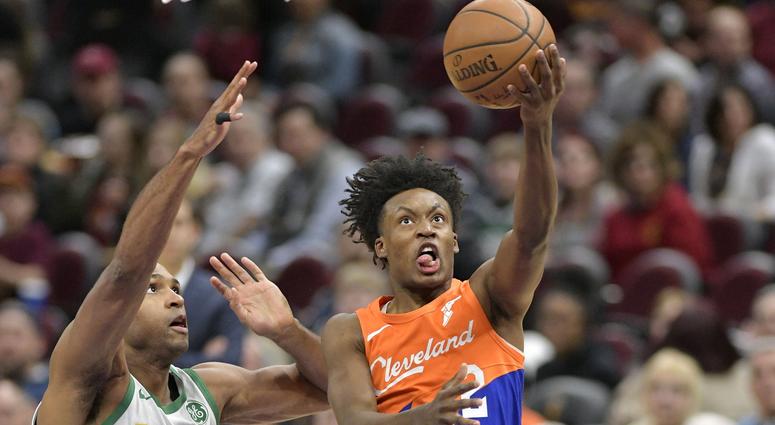 Cleveland Cavaliers guard Collin Sexton (2) drives against Boston Celtics center Al Horford (42) in the first quarter at Quicken Loans Arena