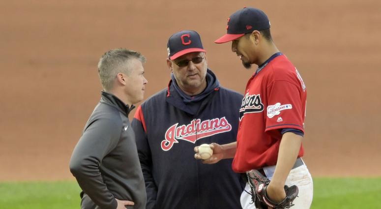 Apr 23, 2019; Cleveland, OH, USA; Cleveland Indians manager Terry Francona (middle) talks with starting pitcher Carlos Carrasco (59) after Carrasco was involved in a collision at first base in the fourth inning against the Miami Marlins at Progressive Apr 23, 2019; Cleveland, OH, USA; Cleveland Indians manager Terry Francona (middle) talks with starting pitcher Carlos Carrasco (59) after Carrasco was involved in a collision at first base in the fourth inning against the Miami Marlins at Progressive Fie