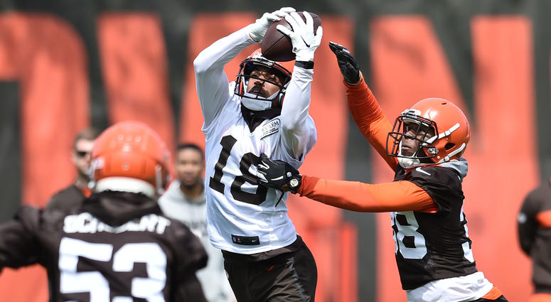 May 15, 2019; Berea, OH, USA; Cleveland Browns wide receiver Damion Ratley (18) catches a pass over cornerback T.J. Carrie during organized team activities at the Cleveland Browns training facility.