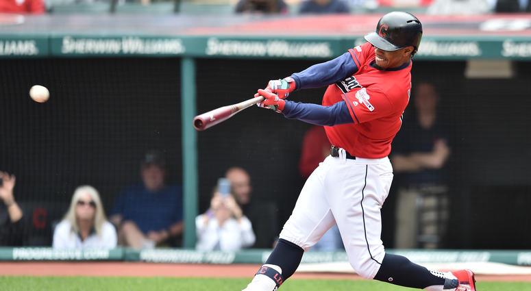 May 22, 2019; Cleveland, OH, USA; Cleveland Indians shortstop Francisco Lindor (12) hits a single during the first inning against the Oakland Athletics at Progressive Field.