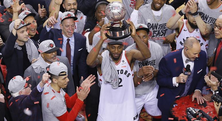 NBA: Playoffs-Milwaukee Bucks at Toronto Raptors Toronto, Ontario, CAN; Toronto Raptors forward Kawhi Leonard (2) hoist the Eastern Conference trophy after winning game six of the Eastern conference finals