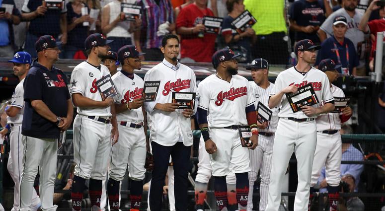 Jul 9, 2019; Cleveland, OH, USA; Cleveland Indians players stand with teammate Carlos Carrasco during the Stand Up For Cancer moment in the 2019 MLB All Star Game at Progressive Field. Mandatory Credit: Charles LeClaire-USA TODAY Sports Jul 9, 2019; Cleveland, OH, USA; Cleveland Indians players stand with teammate Carlos Carrasco during the Stand Up For Cancer moment in the 2019 MLB All Star Game at Progressive Field. Mandatory Credit: Charles LeClaire-USA TODAY Sports