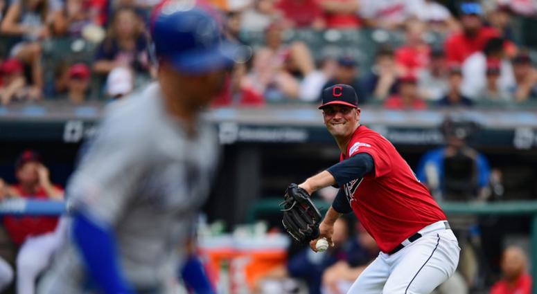 Jul 20, 2019; Cleveland, OH, USA; Cleveland Indians starting pitcher Adam Plutko (45) attempts to throw out Kansas City Royals right fielder Whit Merrifield (15) (not pictured) during the third inning at Progressive Field. Jul 20, 2019; Cleveland, OH, USA; Cleveland Indians starting pitcher Adam Plutko (45) attempts to throw out Kansas City Royals right fielder Whit Merrifield (15) (not pictured) during the third inning at Progressive Field.