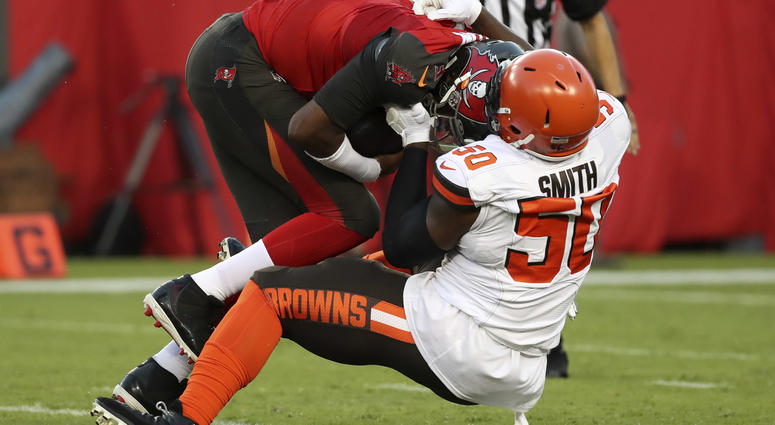 Aug 23, 2019; Tampa, FL, USA; Cleveland Browns defensive end Chris Smith (50) sacks Tampa Bay Buccaneers quarterback Jameis Winston (3) during the first quarter at Raymond James Stadium.