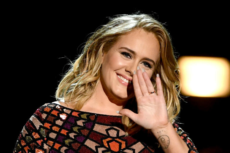 Adele performs onstage during The 59th GRAMMY Awards Adele performs onstage during The 59th GRAMMY Awards