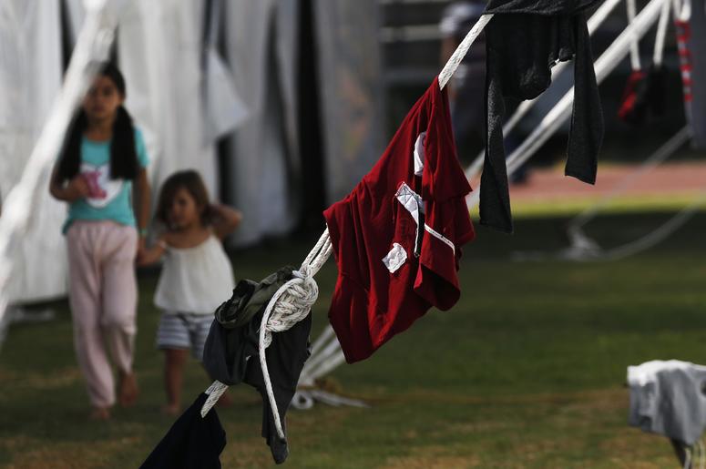 Fotografía de archivo del lunes 28 de enero de 2019 de inmigrantes centroamericanos instalados en un refugio en el estadio Jesús Martínez de la Ciudad de México. Fotografía de archivo del lunes 28 de enero de 2019 de inmigrantes centroamericanos instalados en un refugio en el estadio Jesús Martínez de la Ciudad de México.