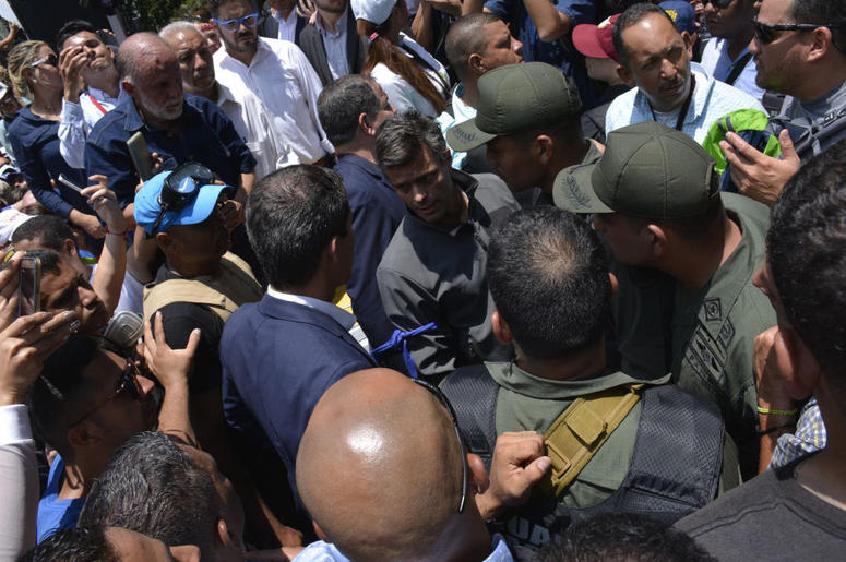 Venezuelan opposition leader Juan Guaidó, recognized by many members of the international community as the country's rightful interim ruler, speaks to opposition activist Leopoldo Lopez as they walk among supporters on April 30, 2019 in Caracas, Venezuela Venezuelan opposition leader Juan Guaidó, recognized by many members of the international community as the country's rightful interim ruler, speaks to opposition activist Leopoldo Lopez as they walk among supporters on April 30, 2019 in Caracas, Venezuela