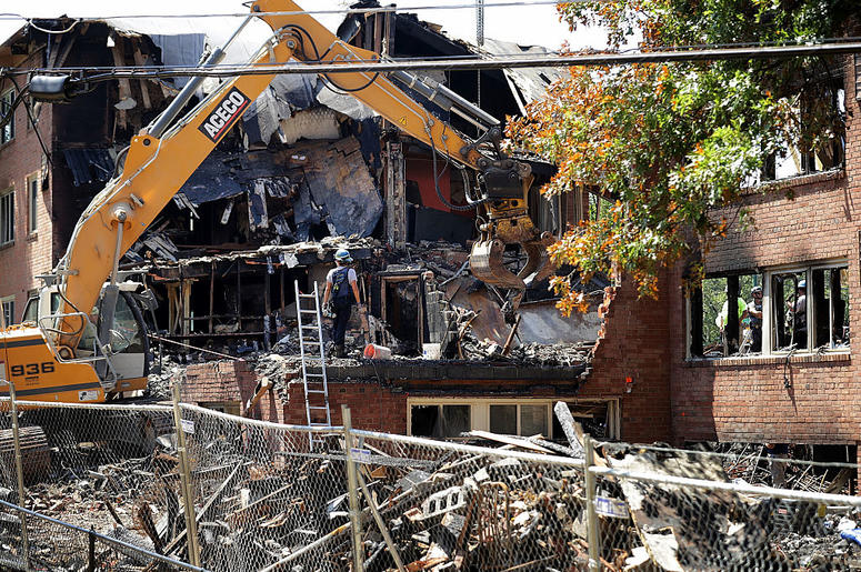 Federal, state and county investigators continue their 'brick-by-brick' inspection of the seciton of the Flower Branch Apartments that exploded and burned last week as they continue searching for one last victim August 16, 2016 in Silver Spring, Maryland. Federal, state and county investigators continue their 'brick-by-brick' inspection of the seciton of the Flower Branch Apartments that exploded and burned last week as they continue searching for one last victim August 16, 2016 in Silver Spring, Maryland.