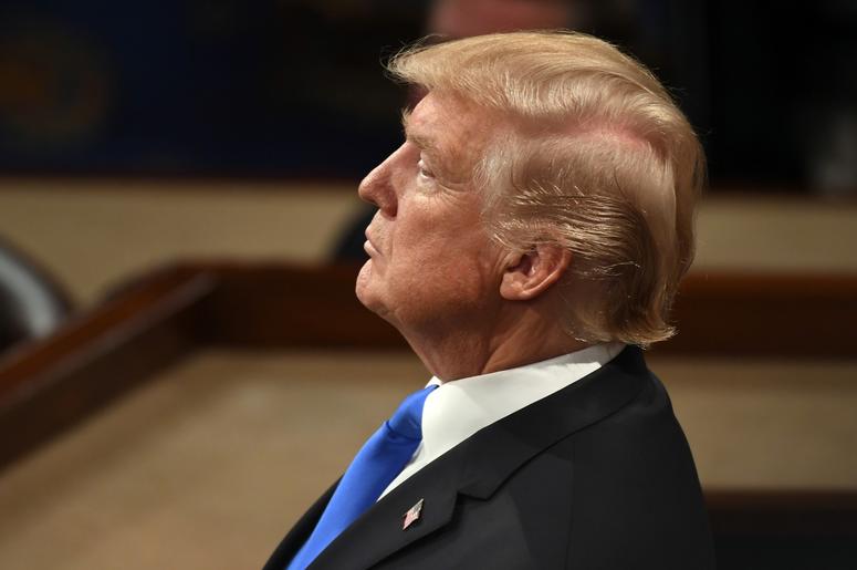 Donald Trump in profile at podium