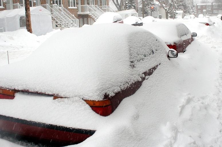 a red car covered in snow