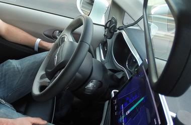 Waymo safety driver Derek Sirakis monitors a self-driving car during a demonstration ride in Chandler. Tempe, Mesa, Chandler and Gilbert will be the first cities in the world with Waymo One self-driving service. Waymo One