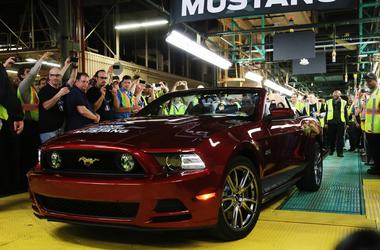 Ford Flat Rock Assembly Plant material planning and logistics manager Ed Salna and Ford group Vice President for Product Development Raj Nair pull up in a Ruby Red 2014 Mustang convertible, April 17, 2013. It's the one millionth Ford Mustang built at the