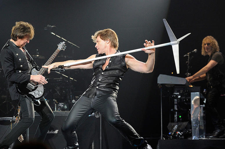 Bon Jovi guitarist Richie Sambora, singer Jon Bon Jovi and keyboardist David Bryan perform at the MGM Grand Garden Arena March 19, 2011 in Las Vegas, Nevada. Bon Jovi guitarist Richie Sambora, singer Jon Bon Jovi and keyboardist David Bryan perform at the MGM Grand Garden Arena March 19, 2011 in Las Vegas, Nevada.