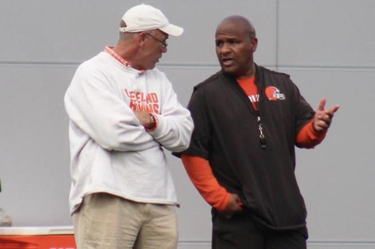 Browns general manager John Dorsey and head coach Hue Jackson speak during a training camp practice. Browns general manager John Dorsey and head coach Hue Jackson speak during a training camp practice.