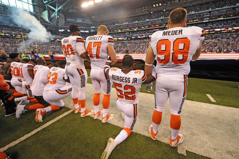 The Cleveland Browns team stand and kneel during the National Anthem The Cleveland Browns team stand and kneel during the National Anthem